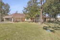 Nestled on nearly 2 acres of picturesque land, this waterfront for sale in Beaumont Texas Jefferson County County on GolfHomes.com