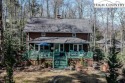 The *gardener's cottage* is tucked by a creek that feeds the for sale in Blowing Rock North Carolina Watauga County County on GolfHomes.com