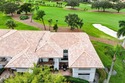 Exceptional golf course views wrap around this renovated for sale in Boynton Beach Florida Palm Beach County County on GolfHomes.com