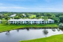Panoramic lake and golf course views will captivate your senses for sale in Boynton Beach Florida Palm Beach County County on GolfHomes.com