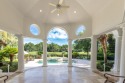 Immerse yourself in this stunning single-story Palladian for sale in Miramar Beach Florida Walton County County on GolfHomes.com