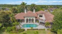Sitting on a prime golf lake front lot, this custom estate for sale in Naples Florida Lee County County on GolfHomes.com