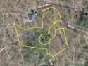 Enjoy a peaceful and scenic wooded setting on 2.77 acres, with for sale in Lake Lure North Carolina Rutherford County County on GolfHomes.com