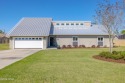 Nestled on a spacious 0.7 acre corner lot, this stunning for sale in Lynn Haven Florida Bay County County on GolfHomes.com