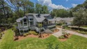 Enjoying views across a lake toward Moss Creek South's 8 th Hole for sale in Hilton Head Island South Carolina Beaufort County County on GolfHomes.com