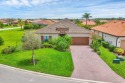 On a generous corner lot within the gated Rosedale Golf and for sale in Bradenton Florida Manatee County County on GolfHomes.com