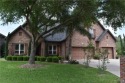 Experience serene pond-side living in this expertly crafted home for sale in Harlingen Texas Cameron County County on GolfHomes.com