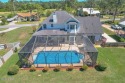 Introducing this exquisite custom-built, single-owner residence for sale in Panama City Beach Florida Bay County County on GolfHomes.com