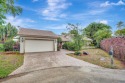 This 3-bedroom, 2-bath traditional home is tucked away on a for sale in Plantation Florida Broward County County on GolfHomes.com