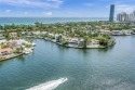 Step off your private elevator into this expansive waterfront for sale in Aventura Florida Miami-Dade County County on GolfHomes.com