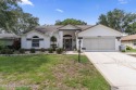 Welcome to this totally updated POOL HOME. SOLAR HEATED POOL for sale in Spring Hill Florida Hernando County County on GolfHomes.com