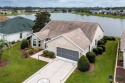 BOND PAID! WATER VIEW! Welcome to this lovely Designer home for sale in The Villages Florida Sumter County County on GolfHomes.com