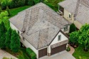 Experience elegance and maintenance-free living in this for sale in Leawood Kansas Johnson County County on GolfHomes.com