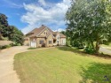 Nestled in The Cliffs at River Forest with a stream that feeds for sale in Forsyth Georgia Monroe County County on GolfHomes.com