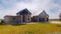 This luxurious 1.5 story custom home is equipped with all the for sale in Castroville Texas Medina County County on GolfHomes.com