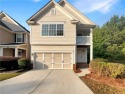 Spacious family home featuring an inviting family room with a for sale in Lithonia Georgia De Kalb County County on GolfHomes.com