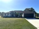 Custom built FIVE bedroom THREE bath pool home connected to for sale in Lehigh Acres Florida Lee County County on GolfHomes.com