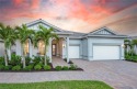 This stunning Renown floor plan is a brand-new, move-in-ready for sale in Naples Florida Collier County County on GolfHomes.com