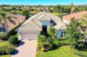 Nestled on a premier lake home site, this maintenance-free home for sale in Lakewood Ranch Florida Manatee County County on GolfHomes.com