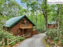 Well-loved mountain home tucked in the woods along the golf for sale in Newland North Carolina Avery County County on GolfHomes.com