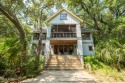 This 4BR, 3.5BA reverse floorplan tucked among mature oaks has for sale in Bald Head Island North Carolina Brunswick County County on GolfHomes.com