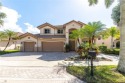 GORGEOUS LAKE FRONT HOME IN THE HIGHLY DESIRABLE GATED COMMUNITY for sale in Weston Florida Broward County County on GolfHomes.com