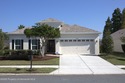 Welcome to this beautifully maintained 3-bedroom, 2-bathroom for sale in Land O'Lakes Florida Pasco County County on GolfHomes.com