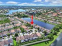 Nestled in a secure, guard-gated community, this stunning for sale in Doral Florida Miami-Dade County County on GolfHomes.com