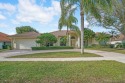 This former model home offers breathtaking lake and golf course for sale in Wellington Florida Palm Beach County County on GolfHomes.com