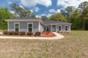 Introducing 297 Parkside Circle, a haven of peace, tranquility for sale in Crawfordville Florida Wakulla County County on GolfHomes.com