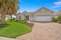 This Huntley II Expanded model is located in the much sought for sale in Ocala Florida Marion County County on GolfHomes.com