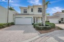 Nestled in the charming community of Larkspur Landing, an for sale in West Palm Beach Florida Palm Beach County County on GolfHomes.com