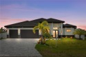 Experience REFINED LIVING in this MODERN LUXURY RESIDENCE in for sale in Cape Coral Florida Lee County County on GolfHomes.com