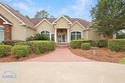 Welcome to this exquisite 4,400 sq ft custom stucco residence for sale in Jesup Georgia Wayne County County on GolfHomes.com