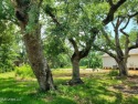 Beautiful corner lot with gorgeous live oaks in the Cedar Point for sale in Bay Saint Louis Mississippi Hancock County County on GolfHomes.com
