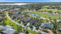 Experience luxury living w/ panoramic golf views in this for sale in Tequesta Florida Martin County County on GolfHomes.com