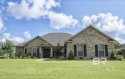 Welcome Home!  Nestled just a +/- mile away from the vibrant OWA for sale in Foley Alabama Baldwin County County on GolfHomes.com