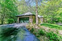 Tucked away in the sought-after community of Kenmure, this home for sale in Flat Rock North Carolina Henderson County County on GolfHomes.com