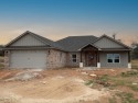 This incredible 4 bed, 2 bath home features an open kitchen for sale in Whitney Texas Hill County County on GolfHomes.com
