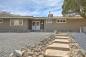 Indulge in some timeless mid-century modern design, beautifully for sale in Albuquerque New Mexico Bernalillo County County on GolfHomes.com