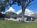MOVE IN CONDITION!  Nestled on a beautifully landscaped and tree for sale in Winter Haven Florida Polk County County on GolfHomes.com