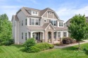 This exquisite home offers a unique blend of warm living spaces for sale in Huntersville North Carolina Mecklenburg County County on GolfHomes.com