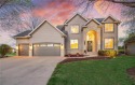 Set on a beautifully landscaped lot overlooking the pristine for sale in Woodbury Minnesota Washington County County on GolfHomes.com