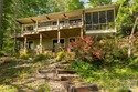 Lakefront living with both water and mountain views! Tucked away for sale in Lake Lure North Carolina Rutherford County County on GolfHomes.com