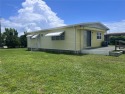 Come see this cheery yellow home, and enjoy sunny Florida living for sale in Bradenton Florida Manatee County County on GolfHomes.com