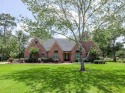 This beautiful home backs up to hole #3 on Idylwild Country Club for sale in Sour Lake Texas Hardin County County on GolfHomes.com