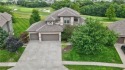 Welcome to this stunning 6-bedroom, 5.1-bathroom estate offering for sale in Raymore Missouri Cass County County on GolfHomes.com