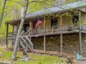 Welcome to On The Rocks! Discover this rare gem, a tastefully for sale in Terra Alta West Virginia Preston County County on GolfHomes.com