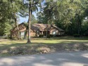 One owner custom built 1995 ranch with open floor plan. Situated for sale in Holly Lake Ranch Texas Wood County County on GolfHomes.com
