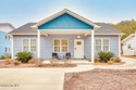 Coastal charm and a fantastic location come together in this for sale in Oak Island North Carolina Brunswick County County on GolfHomes.com